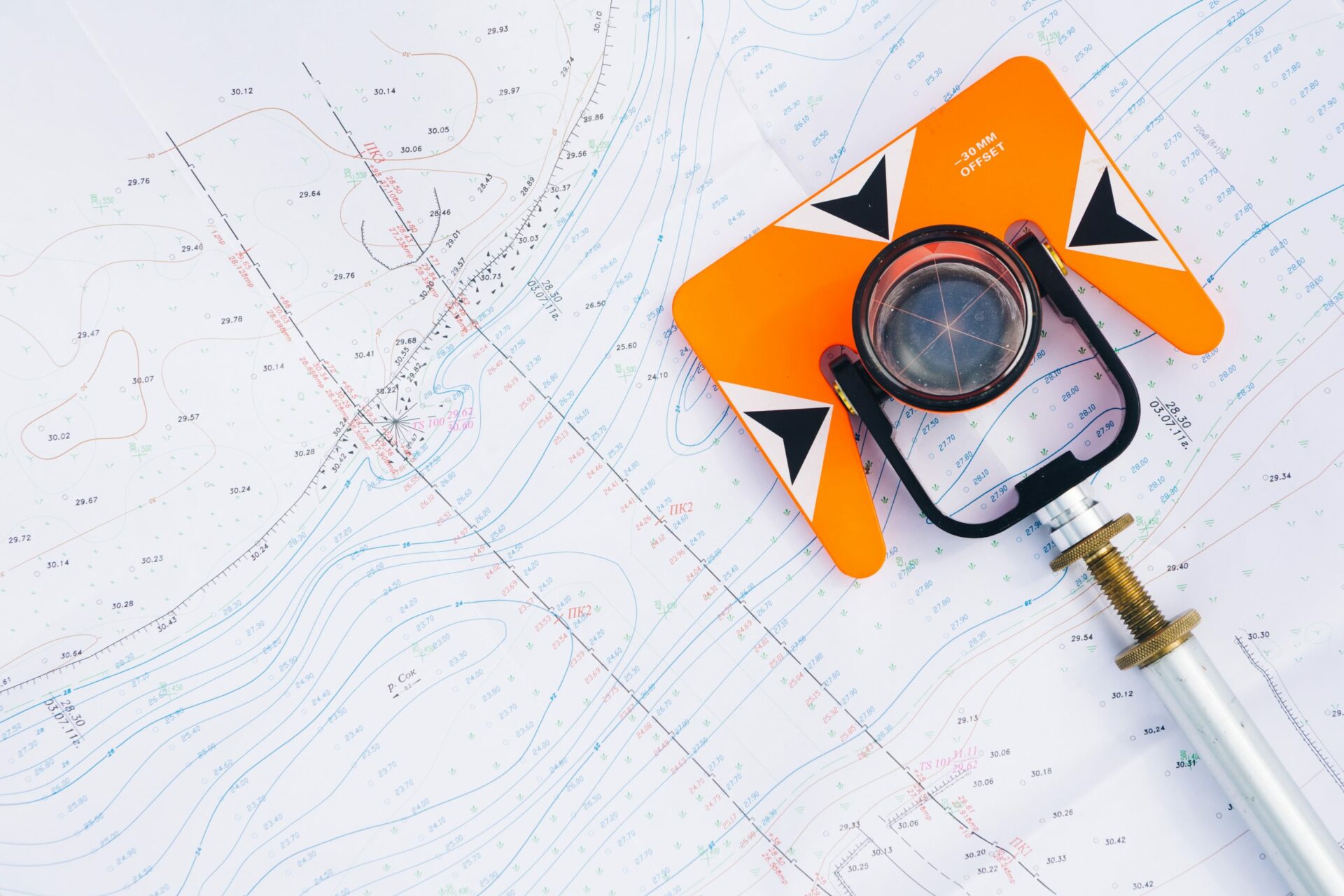 Theodolite Prism atop a map and table